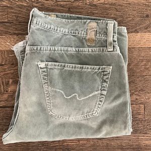 Mens AG corduroy jeans in faded green.